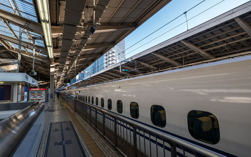 Train at railroad station against sky