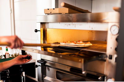 Cropped image of hand holding coffee