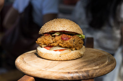 Close-up of burger on wooden table