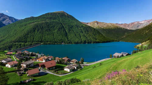 Scenic view of lake and mountains against sky