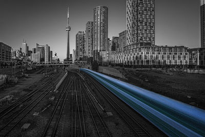 View of railroad tracks with buildings in background