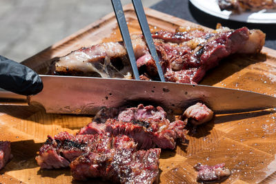 High angle view of meat on barbecue grill