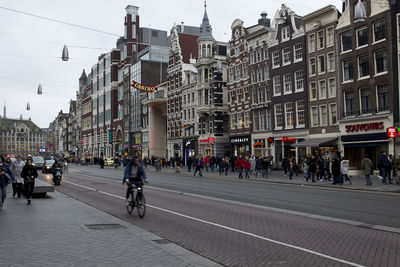 Group of people walking on city street