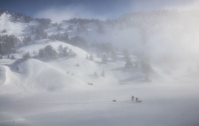 Scenic view of snow covered mountains