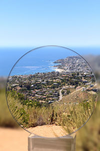 Close-up of glass against clear sky