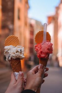 Cropped hand holding ice cream cone