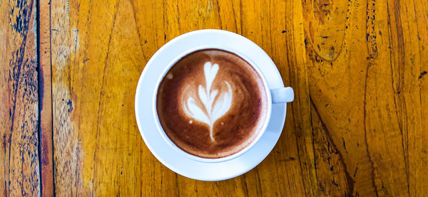 Directly above shot of coffee cup on table