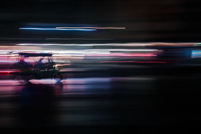 Light trails on city street at night