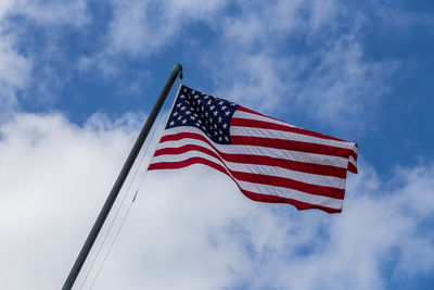 Low angle view of flag against sky