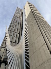 Low angle view of modern building against sky. building in paseo de la castellana, madrid. 