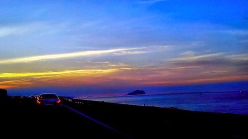 Scenic view of sea against sky at sunset