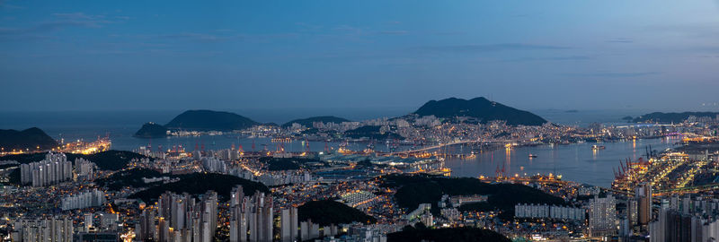 High angle view of city lit up at night