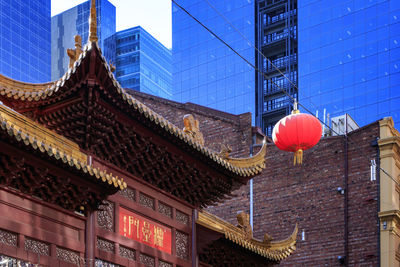 Low angle view of lanterns hanging on building