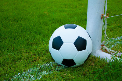 Close-up of soccer ball on field