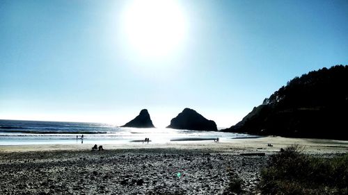 Scenic view of sea against sky on sunny day