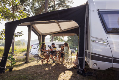 Family relaxing at camping site