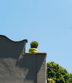 High section of built structure against clear sky