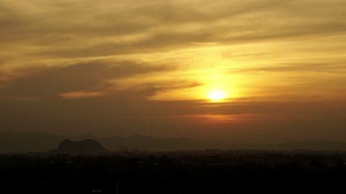 Scenic view of silhouette landscape against romantic sky at sunset