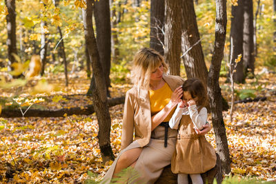 Women in forest during autumn