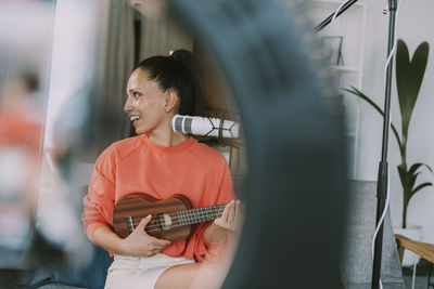 Young woman playing guitar