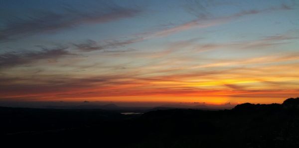 Scenic view of dramatic sky during sunset