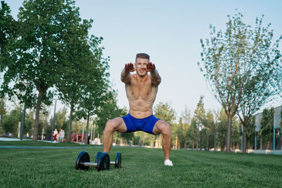 Full length of man exercising in park