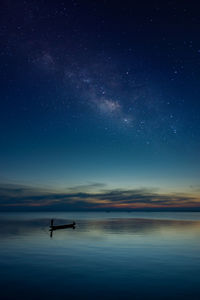 Scenic view of sea against sky at night