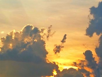 Low angle view of dramatic sky during sunset