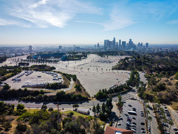 High angle view of road by buildings against sky