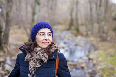 Woman looking away in forest