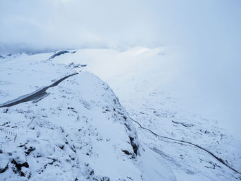 Scenic view of snow covered mountain against sky