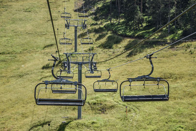 High angle view of empty ski lift chairs 