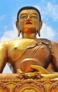 Low angle view of statue against sky