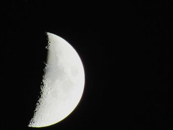 Low angle view of moon against sky at night