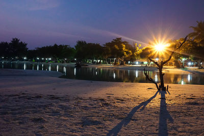 Scenic view of beach against sky at night