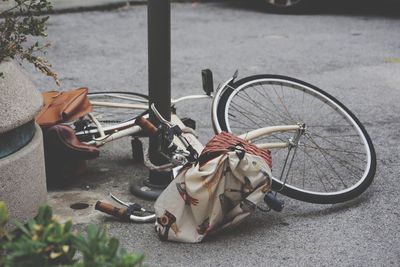 High angle view of fallen bicycle on road