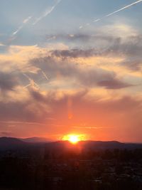 Scenic view of sunset over mountains