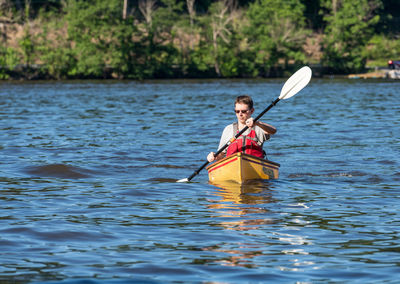 Portrait of man in boat on lake