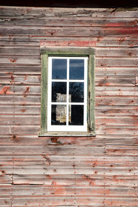 Low angle view of window on old building