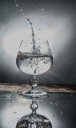 Close-up of water splashing on glass