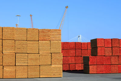 Stack of building against clear blue sky