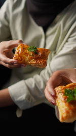 Midsection of woman holding food