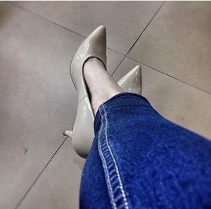 Low section of woman standing on tiled floor