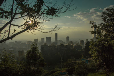 Cityscape against sky during sunset