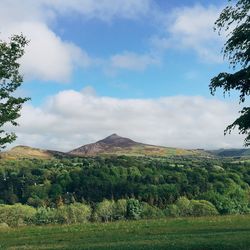 Scenic view of landscape against cloudy sky