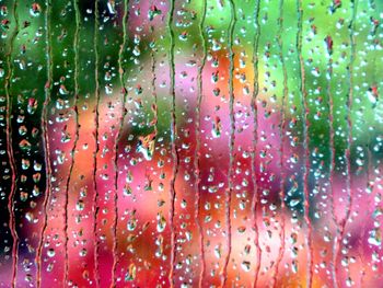 Full frame shot of wet window during rainy season