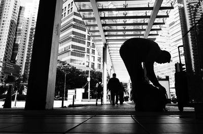 Silhouette people walking in modern office building