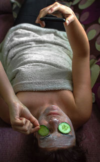 Midsection of woman lying down