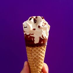 Cropped hand holding ice cream