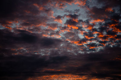 Low angle view of dramatic sky during sunset